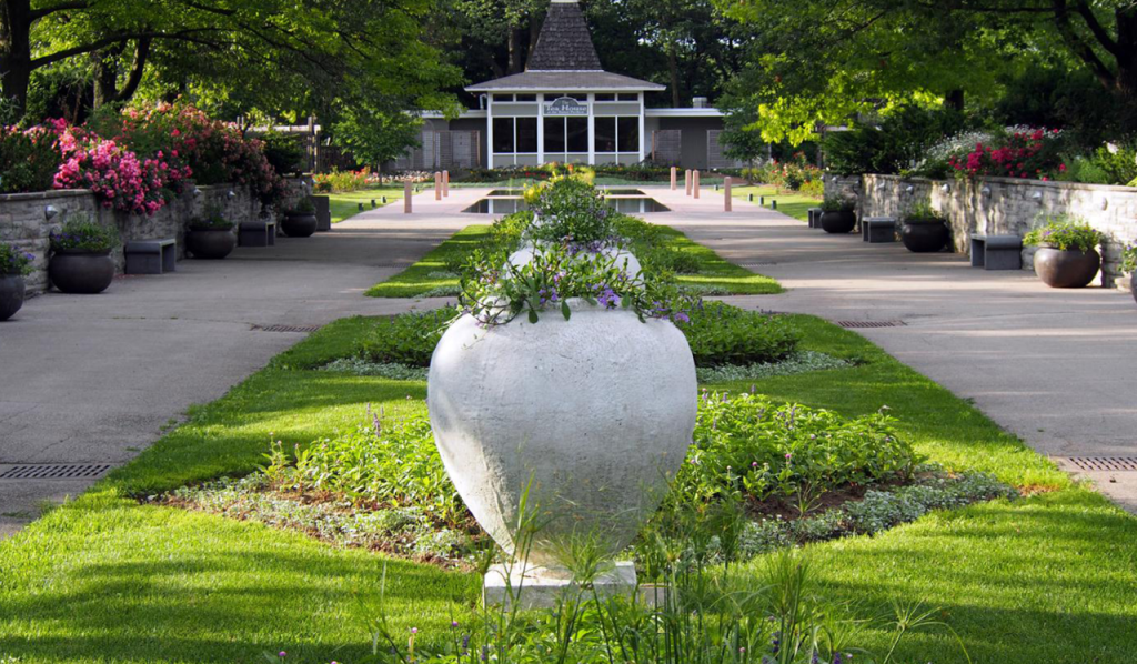 Middle row of planters on grass with pathways on each side