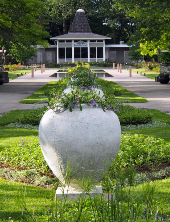 Middle row of planters on grass with pathways on each side style='width:100%'